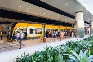 Passengers using tram at University Hospital station